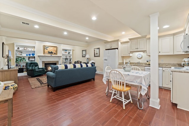 273 Bel Grene Dr, Fishersville, VA 22939 - dining space with visible vents, recessed lighting, crown molding, dark wood-style floors, and a glass covered fireplace