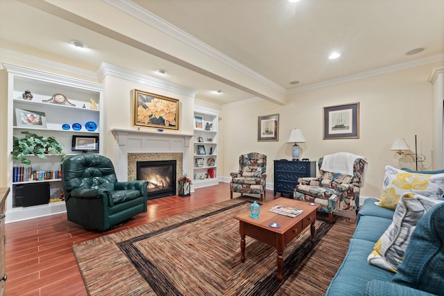 273 Bel Grene Dr, Fishersville, VA 22939 - living room featuring wood finished floors, crown molding, built in features, baseboards, and a glass covered fireplace