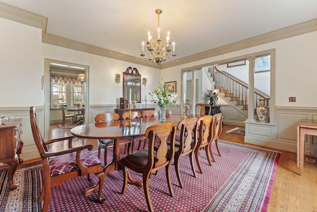273 Bel Grene Dr, Fishersville, VA 22939 - dining area featuring wainscoting, an inviting chandelier, ornamental molding, and light wood-style floors