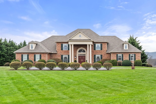273 Bel Grene Dr, Fishersville, VA 22939 - greek revival house with a shingled roof, brick siding, and a front yard