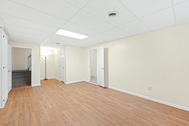 409 Thomas St, Staunton, VA 24401 - spare room featuring a paneled ceiling, light wood-style flooring, stairs, and baseboards