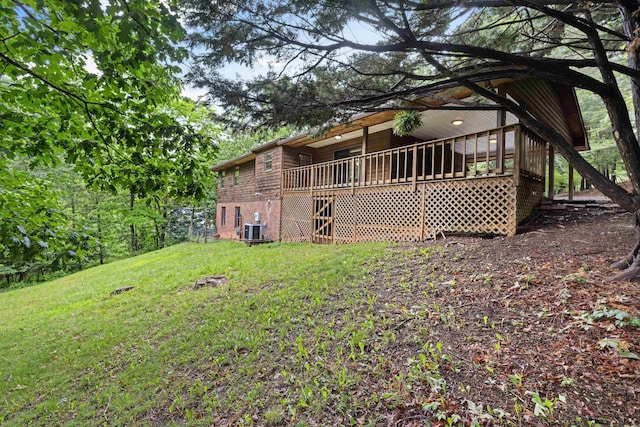 409 Thomas St, Staunton, VA 24401 - rear view of house featuring central AC unit, a lawn, and a deck