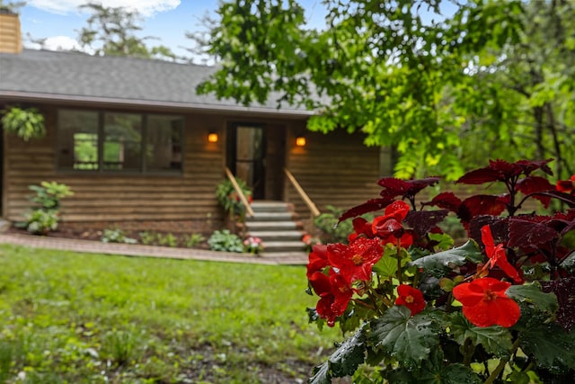 409 Thomas St, Staunton, VA 24401 - view of front of home with a shingled roof, a chimney, and a front lawn