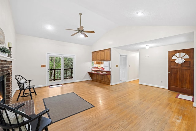 409 Thomas St, Staunton, VA 24401 - living room with a fireplace, ceiling fan, light wood-style flooring, high vaulted ceiling, and baseboards
