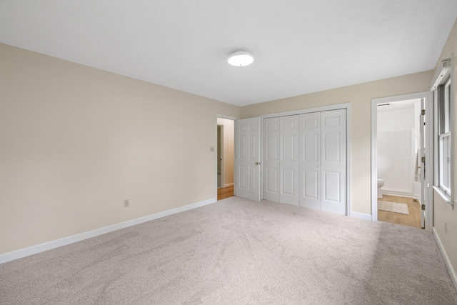 409 Thomas St, Staunton, VA 24401 - unfurnished bedroom with carpet floors, baseboards, a closet, and ensuite bathroom