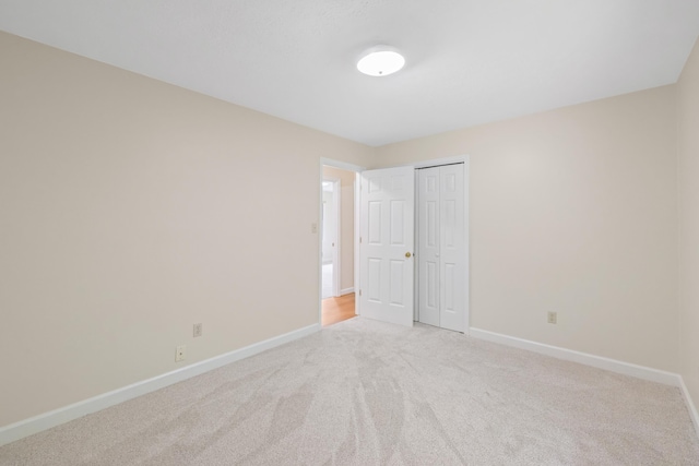 409 Thomas St, Staunton, VA 24401 - unfurnished bedroom with baseboards, light colored carpet, and a closet