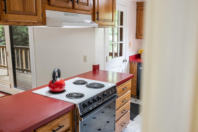 409 Thomas St, Staunton, VA 24401 - kitchen featuring electric stove, under cabinet range hood, and brown cabinets
