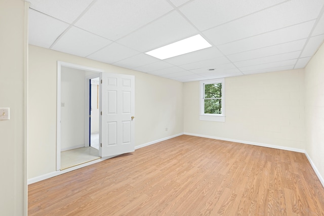 409 Thomas St, Staunton, VA 24401 - empty room with a drop ceiling, light wood-style flooring, and baseboards