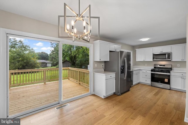 809 Sherwood Ln, Fredericksburg, VA 22407 - kitchen with stainless steel appliances, healthy amount of natural light, light countertops, and light wood-style flooring