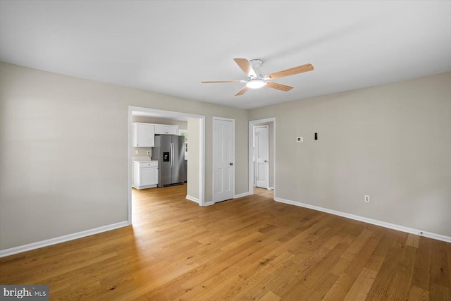 809 Sherwood Ln, Fredericksburg, VA 22407 - unfurnished living room with a ceiling fan and light wood-style flooring