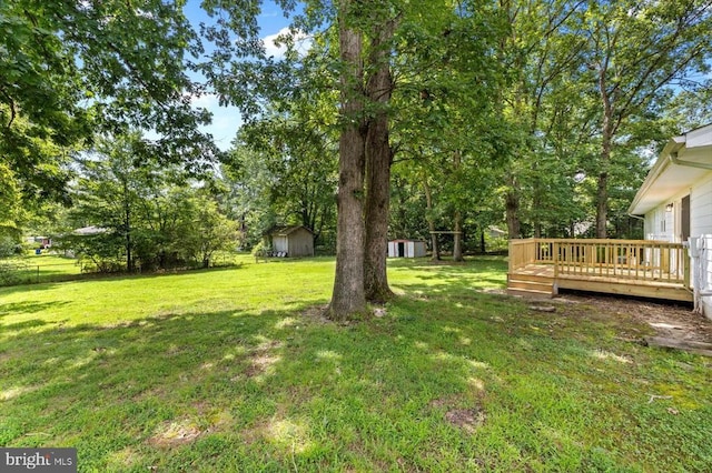 809 Sherwood Ln, Fredericksburg, VA 22407 - view of green lawn with a shed and a wooden deck