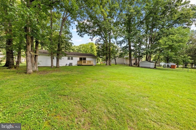 809 Sherwood Ln, Fredericksburg, VA 22407 - view of grassy yard with a deck