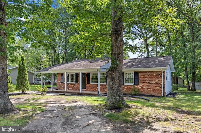 809 Sherwood Ln, Fredericksburg, VA 22407 - ranch-style home featuring brick siding, covered porch, and roof with shingles
