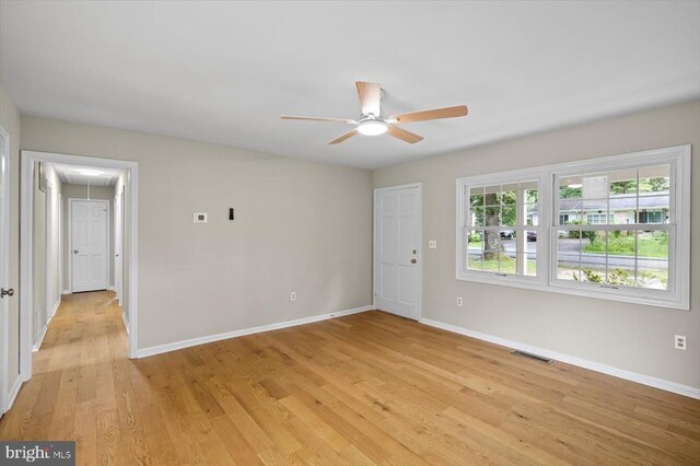809 Sherwood Ln, Fredericksburg, VA 22407 - spare room featuring attic access, a ceiling fan, and light wood-style floors