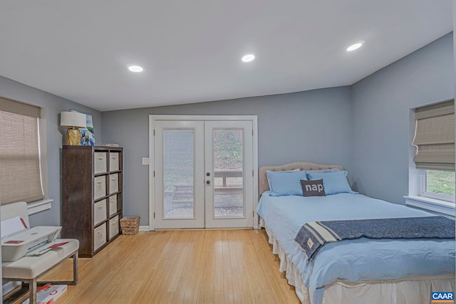 bedroom featuring french doors, access to exterior, light wood-style flooring, and recessed lighting