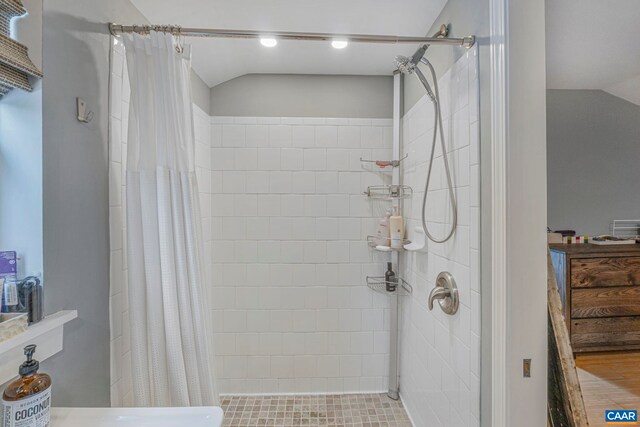 316 6 1/2 St, Charlottesville, VA 22903 - bathroom with vaulted ceiling and tiled shower