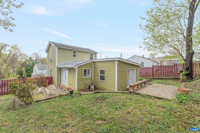 316 6 1/2 St, Charlottesville, VA 22903 - back of property featuring a wooden deck, central air condition unit, and a patio
