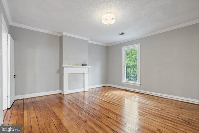 105 Washington St E, Remington, VA 22734 - unfurnished living room with hardwood / wood-style floors, ornamental molding, baseboards, a textured ceiling, and a fireplace