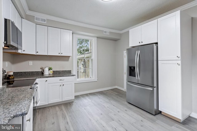 105 Washington St E, Remington, VA 22734 - kitchen featuring appliances with stainless steel finishes, white cabinets, light wood-style floors, and ornamental molding