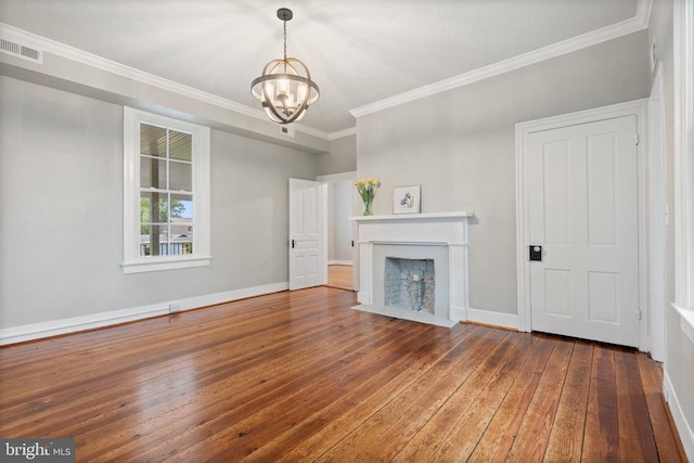 105 Washington St E, Remington, VA 22734 - unfurnished living room featuring wood-type flooring, a chandelier, crown molding, a fireplace with flush hearth, and baseboards