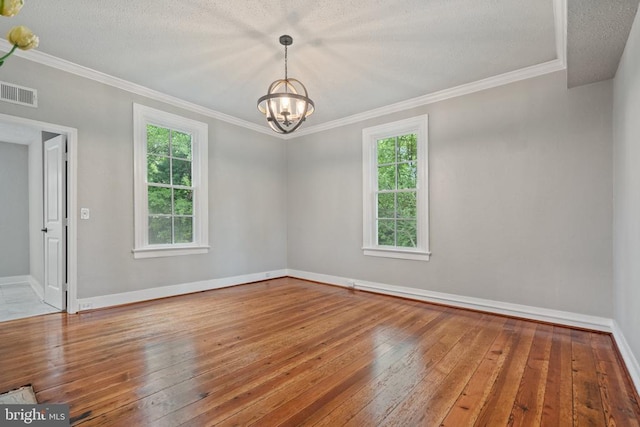 105 Washington St E, Remington, VA 22734 - spare room featuring hardwood / wood-style floors, a chandelier, ornamental molding, and a textured ceiling