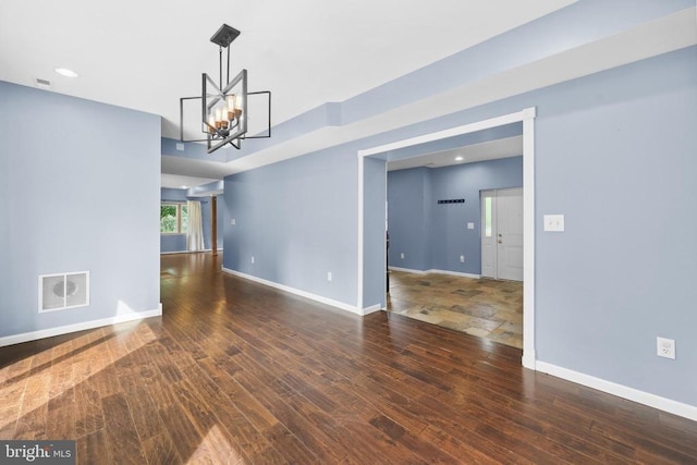  - spare room featuring a chandelier, hardwood / wood-style flooring, and recessed lighting