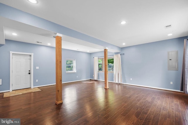  - spare room featuring ornate columns, electric panel, hardwood / wood-style flooring, and recessed lighting