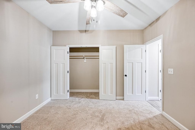 unfurnished bedroom with baseboards, a closet, ceiling fan, and carpet floors