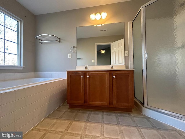 4213 Normandy Ct, Fredericksburg, VA 22408 - full bathroom with double vanity, a stall shower, a garden tub, and plenty of natural light