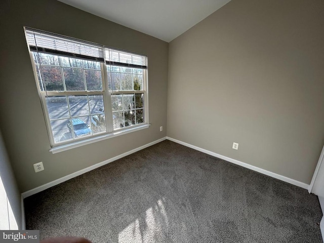 4213 Normandy Ct, Fredericksburg, VA 22408 - spare room featuring baseboards, dark colored carpet, and vaulted ceiling