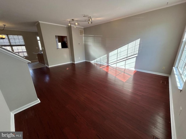 4213 Normandy Ct, Fredericksburg, VA 22408 - unfurnished living room with a chandelier, ornamental molding, dark wood finished floors, healthy amount of natural light, and baseboards