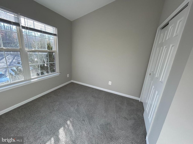 4213 Normandy Ct, Fredericksburg, VA 22408 - unfurnished bedroom featuring dark colored carpet, baseboards, and a closet