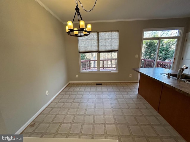 4213 Normandy Ct, Fredericksburg, VA 22408 - unfurnished dining area with a chandelier, healthy amount of natural light, baseboards, and ornamental molding