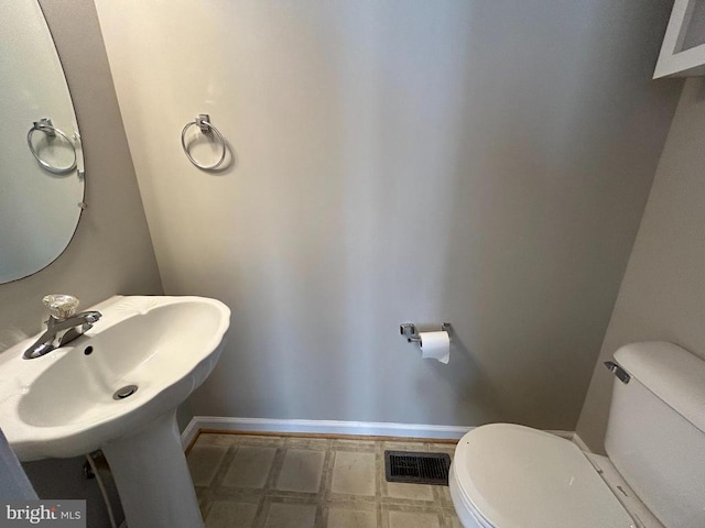 4213 Normandy Ct, Fredericksburg, VA 22408 - half bath with toilet, tile patterned floors, baseboards, and a sink