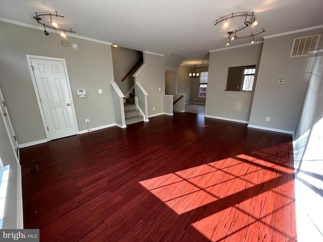 4213 Normandy Ct, Fredericksburg, VA 22408 - unfurnished living room featuring crown molding, wood finished floors, stairway, rail lighting, and a chandelier
