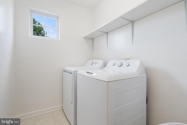 12303 Osprey Ln, Culpeper, VA 22701 - washroom featuring washer and dryer, light tile patterned flooring, and baseboards