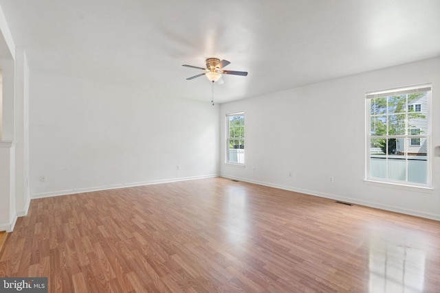 12303 Osprey Ln, Culpeper, VA 22701 - spare room featuring ceiling fan, light wood-style floors, and baseboards