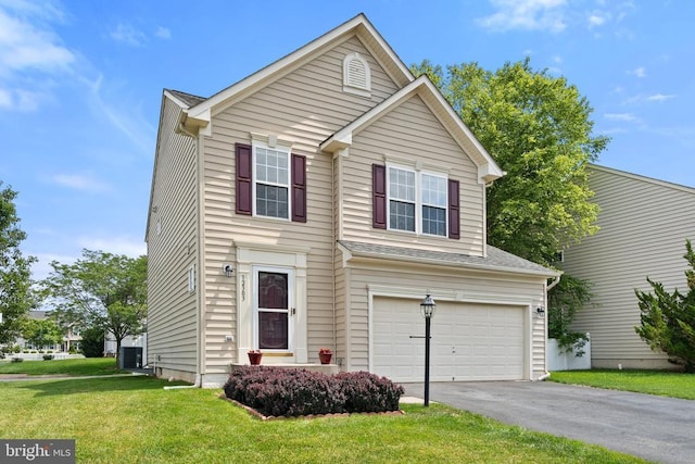 12303 Osprey Ln, Culpeper, VA 22701 - traditional-style house featuring a garage, asphalt driveway, a front yard, and central AC unit