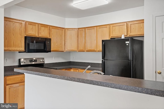 12303 Osprey Ln, Culpeper, VA 22701 - kitchen with black appliances, dark countertops, and a sink