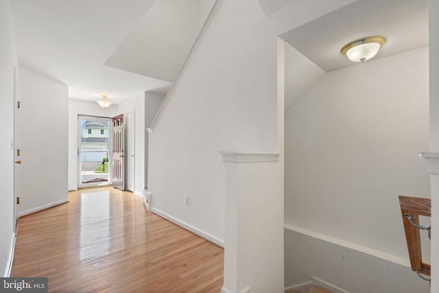 12303 Osprey Ln, Culpeper, VA 22701 - hallway with wood finished floors, baseboards, and an upstairs landing