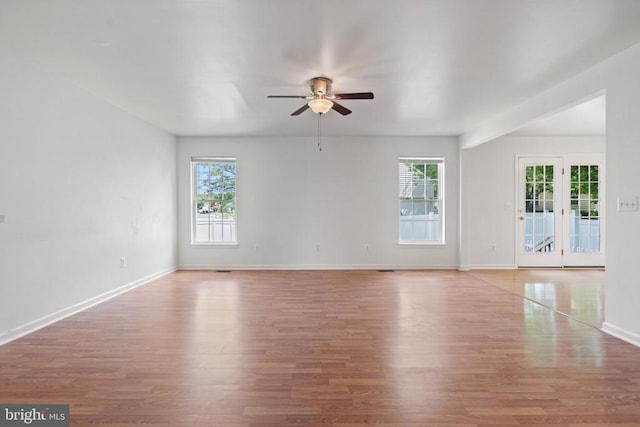 12303 Osprey Ln, Culpeper, VA 22701 - spare room featuring healthy amount of natural light, ceiling fan, wood finished floors, and baseboards