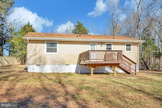 rear view of property featuring crawl space, a deck, and stairs