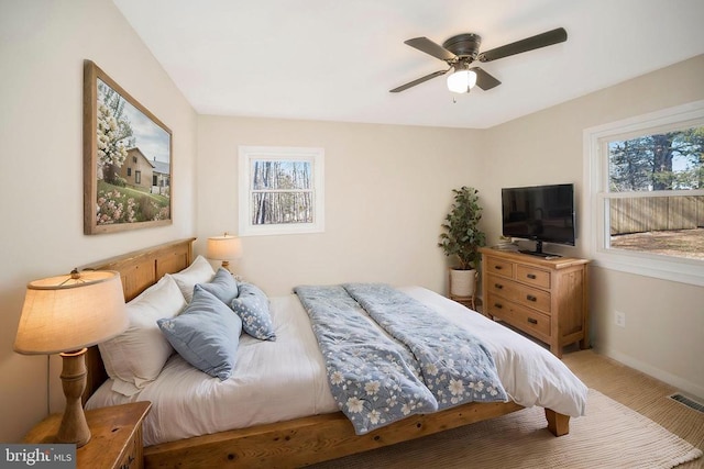 bedroom with baseboards and a ceiling fan