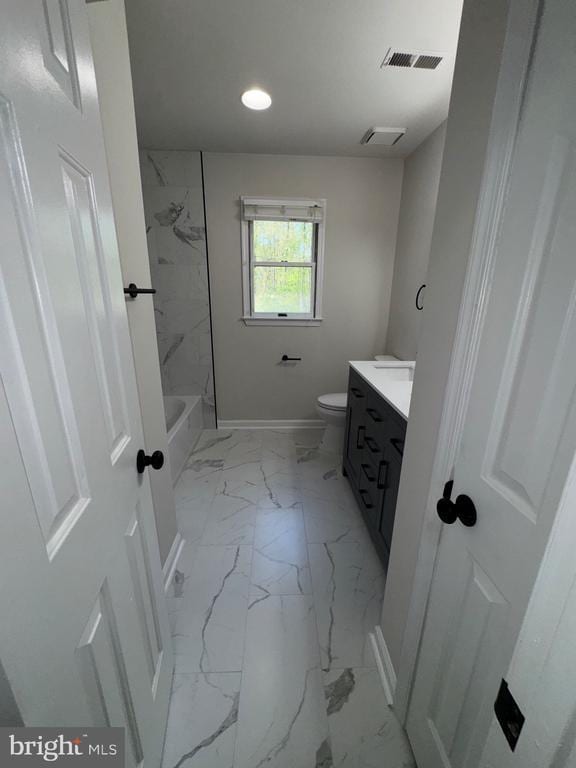 12704 Getty Ln, Spotsylvania, VA 22551 - bathroom featuring vanity, marble finish flooring, recessed lighting, and shower / washtub combination