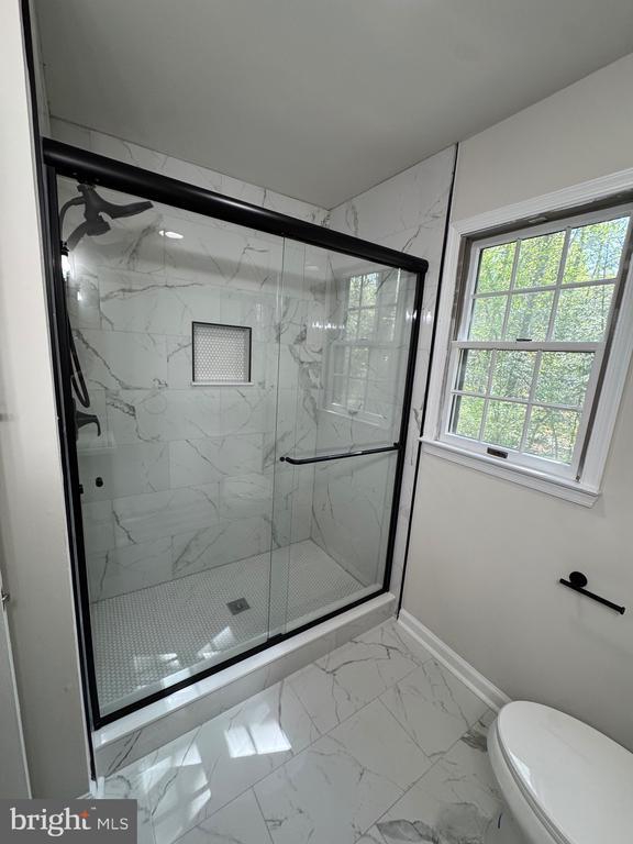 12704 Getty Ln, Spotsylvania, VA 22551 - full bathroom with marble finish flooring and a marble finish shower
