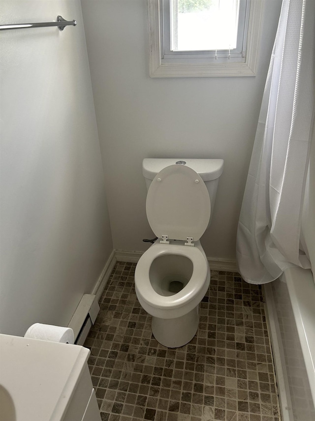 125 Mccutchen School Ln, Goshen, VA 24439 - bathroom featuring baseboard heating and a shower with curtain