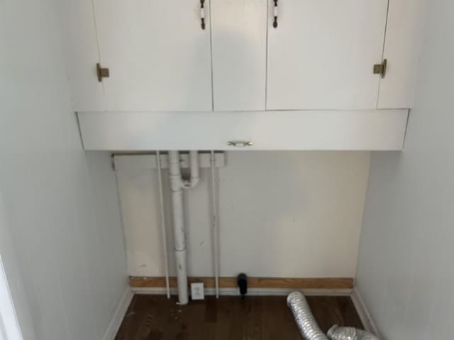 125 Mccutchen School Ln, Goshen, VA 24439 - laundry room with dark wood-style floors and cabinet space