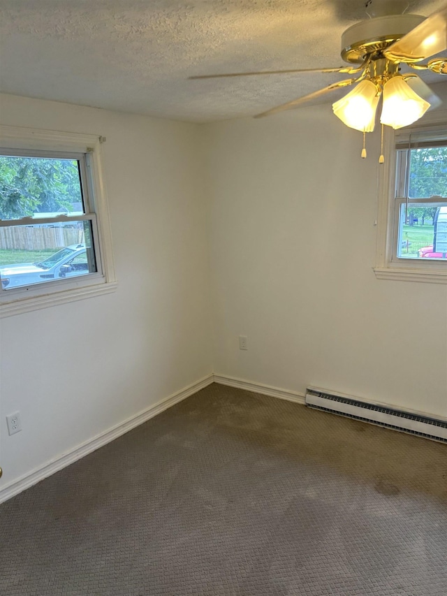 125 Mccutchen School Ln, Goshen, VA 24439 - empty room with a baseboard radiator, dark colored carpet, ceiling fan, and a textured ceiling