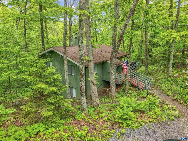134 Gumtree Dr, Wintergreen Resort, VA 22967 - view of side of property with a shingled roof and a forest view