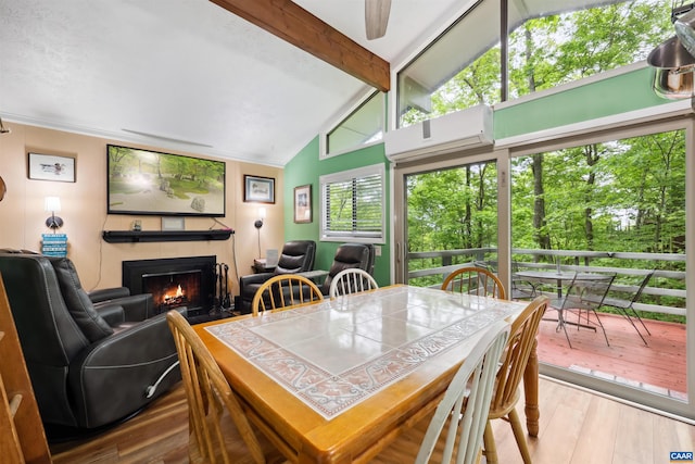 134 Gumtree Dr, Wintergreen Resort, VA 22967 - dining room with a lit fireplace and hardwood / wood-style floors